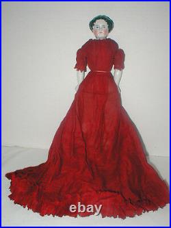 12 Germany flat top china head in orig dark red cotton dress & cotton slip