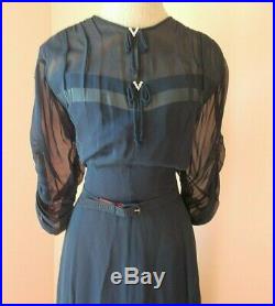 Delightful navy dress. Love the see through slip.'diamond bows c. 1945
