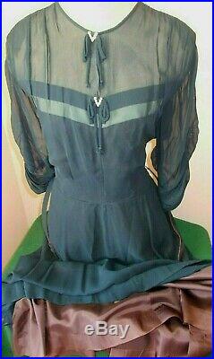 Delightful navy dress. Love the see through slip.'diamond bows c. 1945
